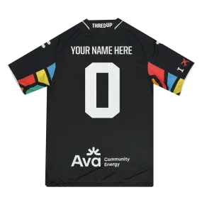 A black sports jersey with geometric sleeves features "YOUR NAME HERE" above a white "0" on the back. "Ava Community Energy" appears at the bottom, with the "THREDUP" logo on top. Ideal for fans of Oakland Roots SC'